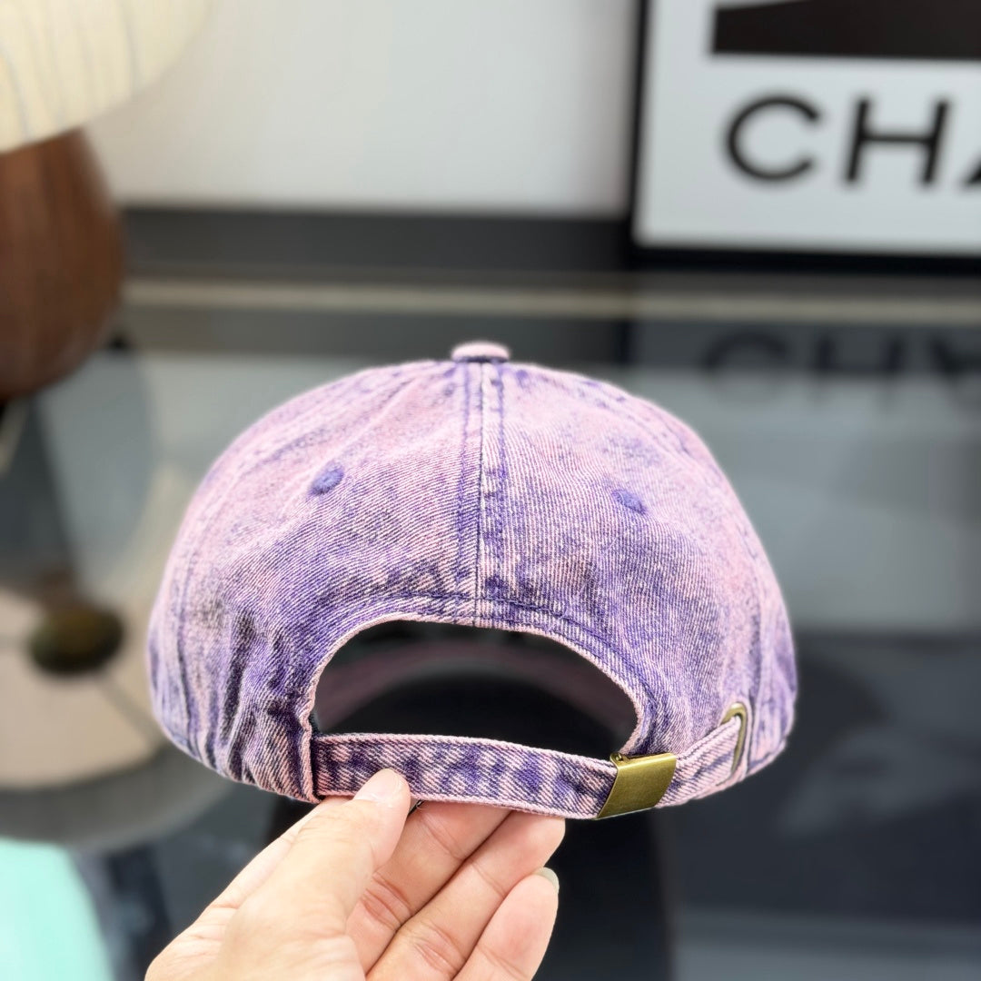 Distressed purple washed denim baseball cap with front embroidery patch, adjustable strap back.