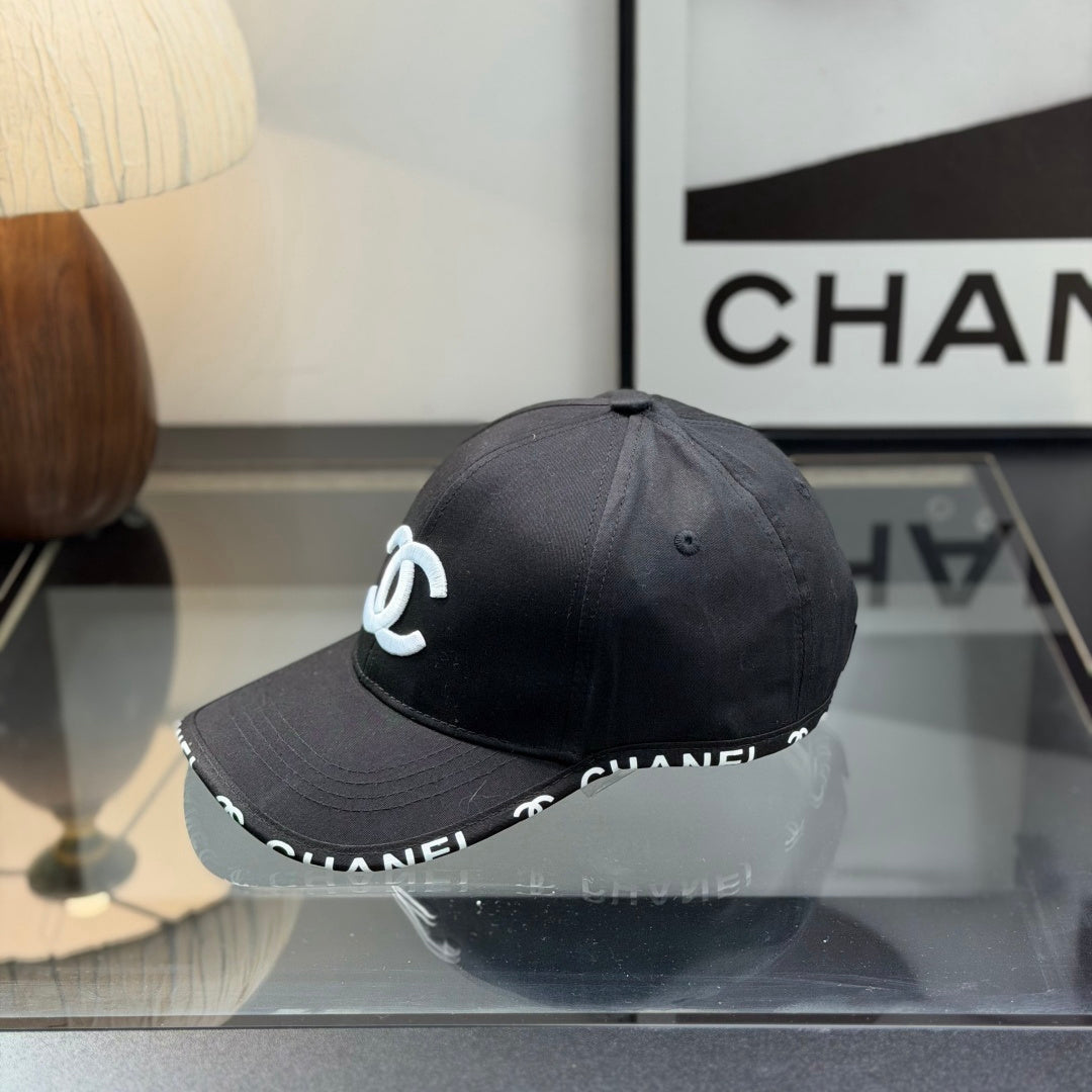 A classic black baseball cap featuring white embroidered logo, sturdy cotton blend, adjustable strap
