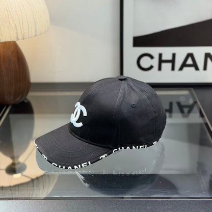 A classic black baseball cap featuring white embroidered logo, sturdy cotton blend, adjustable strap
