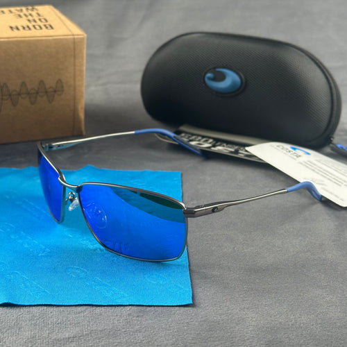 Close-up of performance polarized sunglasses with blue mirror lenses and lightweight metal frame.