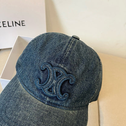 Washed blue denim cap with tonal emblem and gold buckle