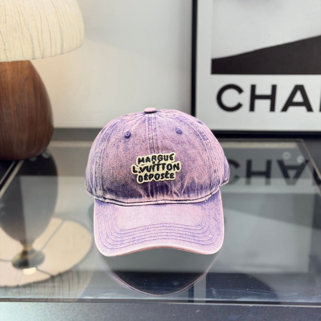 Distressed purple washed denim baseball cap with front embroidery patch, adjustable strap back.