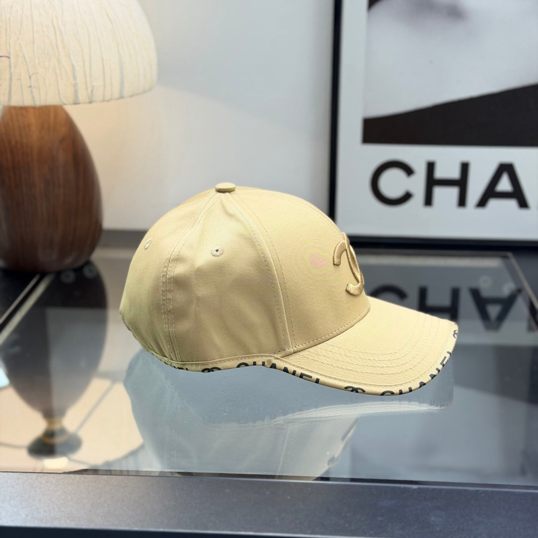A premium structured baseball cap in a neutral beige tone featuring an embroidered central logo.