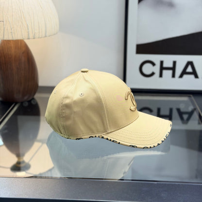 A premium structured baseball cap in a neutral beige tone featuring an embroidered central logo.