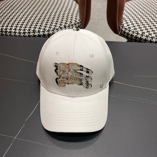 A white structured cotton baseball cap featuring an intricate equestrian embroidery patch on front.
