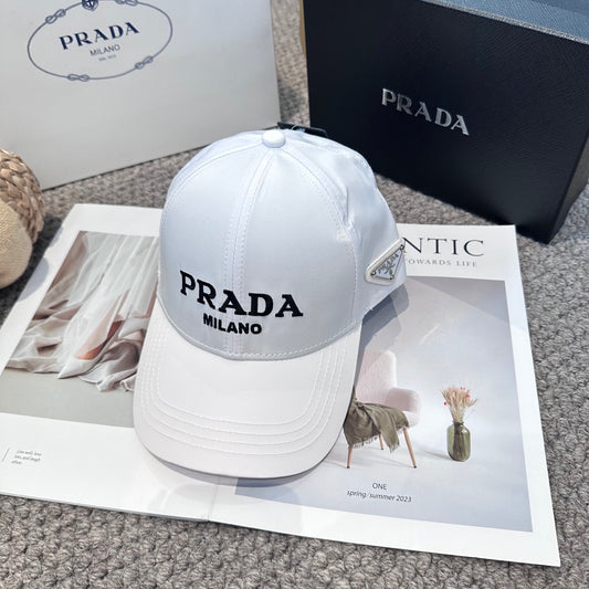 A clean white baseball cap featuring black embroidered lettering, structured crown, and curved visor
