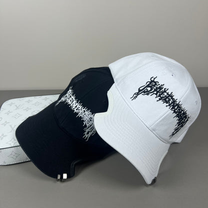 White cotton cap with black graphic embroidery and sculpted brim
