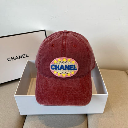 Red distressed cotton baseball cap featuring a colorful embroidered circular graphic patch.