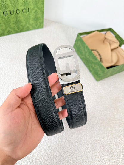 Premium black leather belt with a modern silver automatic steel buckle and detailed grain texture.