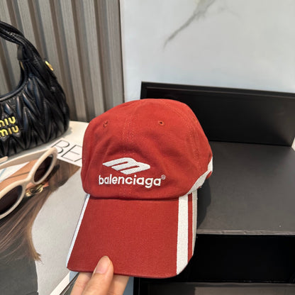 A vibrant red baseball cap featuring bold white side stripes and centered white embroidery.