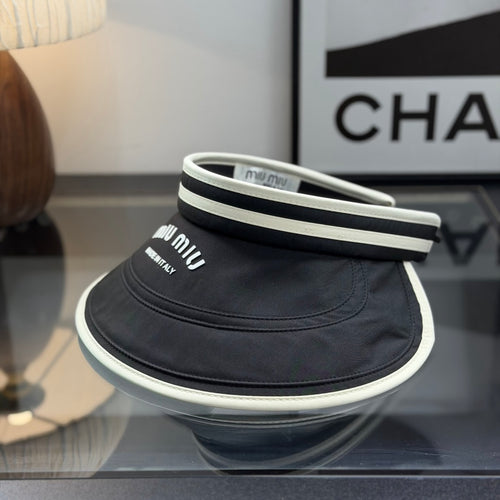 A black sun visor with white contrast trim, featuring an open-top design for breathability and sun p