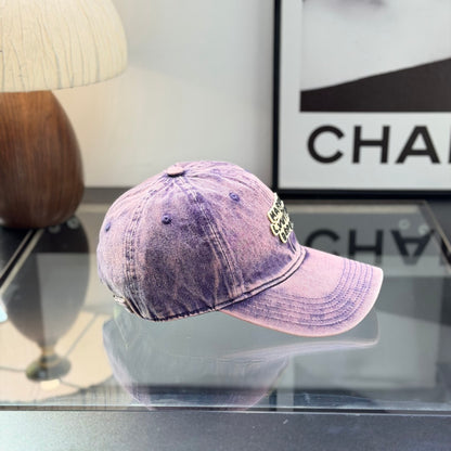 Distressed purple washed denim baseball cap with front embroidery patch, adjustable strap back.