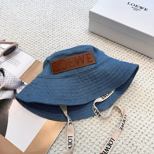 Denim bucket hat with embossed patch and detachable strap