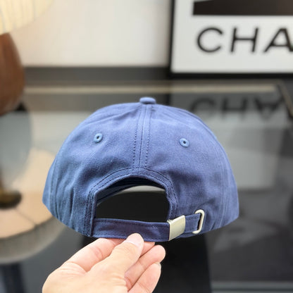 A navy blue cotton baseball cap with a rectangular tan leather-style patch on the front panel.
