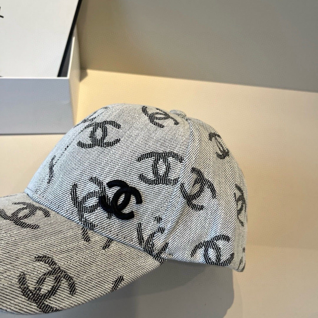 Classic monogram patterned denim baseball cap with an adjustable metallic buckle strap.