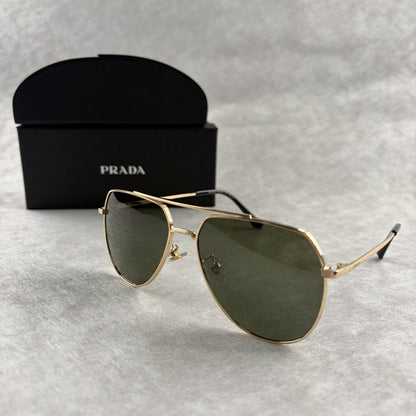 Classic gold-tone metal aviator sunglasses with tinted lenses, resting next to a protective case.