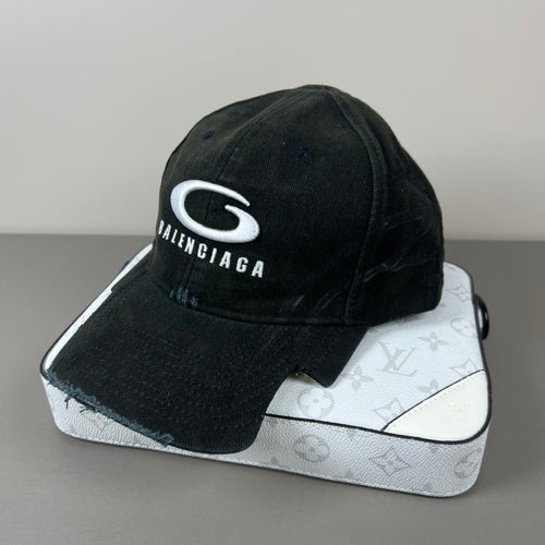 Black distressed cotton cap with contrast emblem and graffiti underbrim