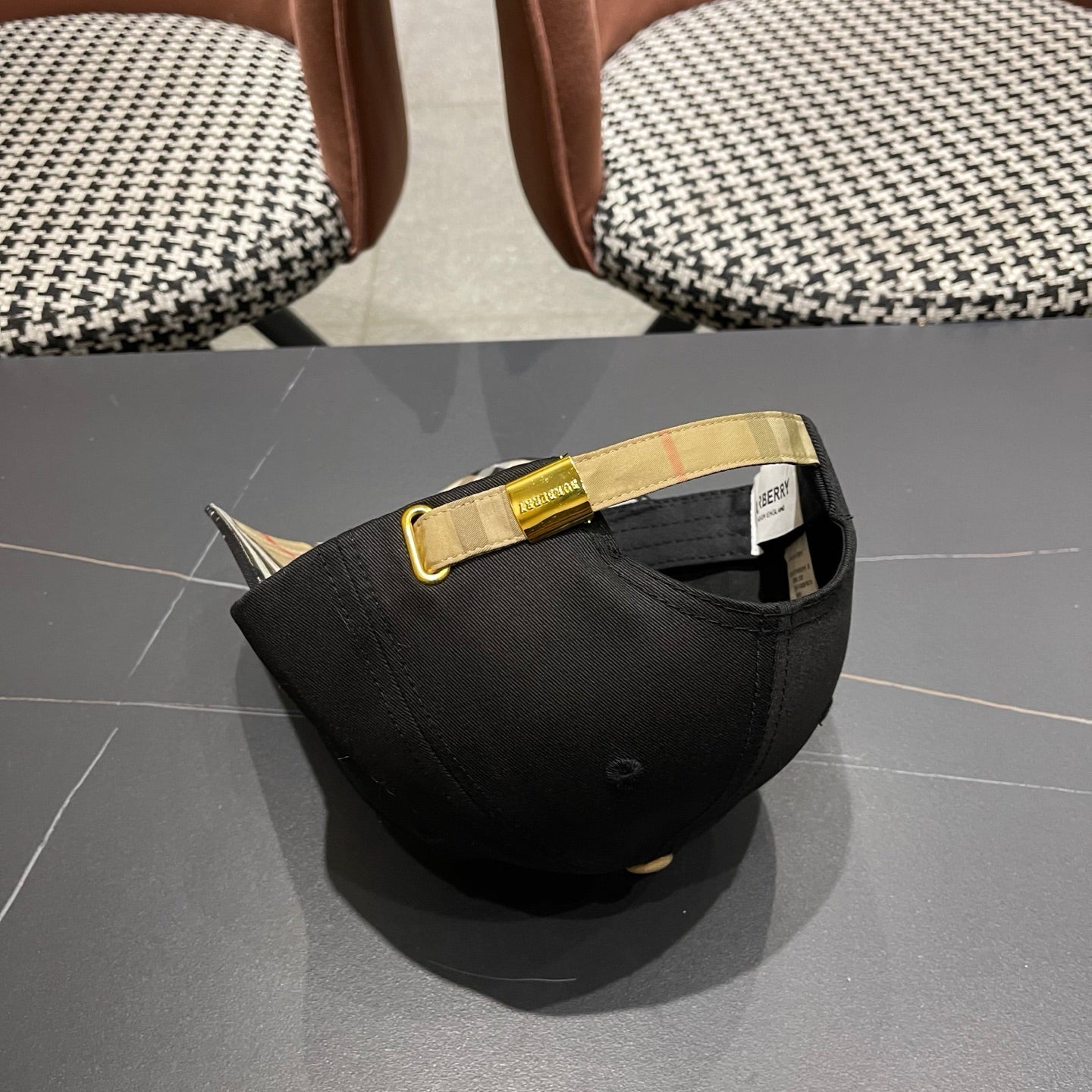 Black cotton baseball cap with intricate equestrian embroidery and a subtle metallic side accent.