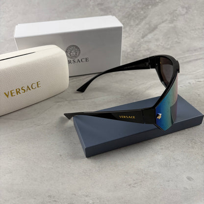 Modern shield-style visor sunglasses with wide black frames and vibrant gradient mirror lenses.