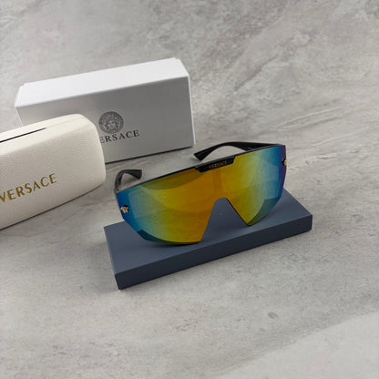 Modern shield-style visor sunglasses with wide black frames and vibrant gradient mirror lenses.
