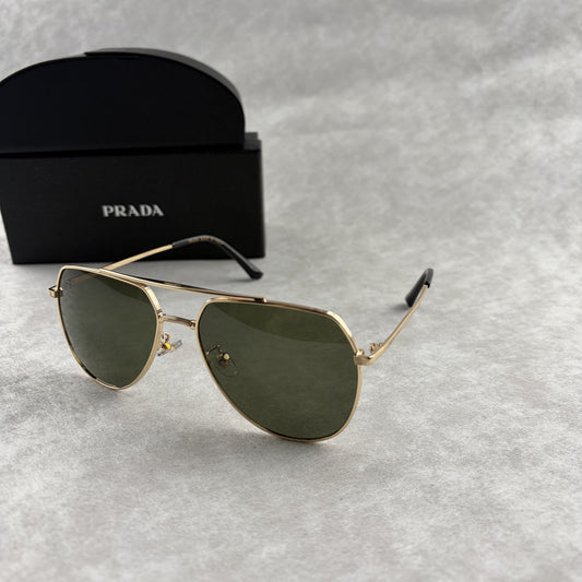 Classic gold-tone metal aviator sunglasses with tinted lenses, resting next to a protective case.