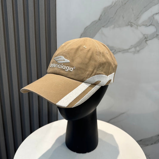 Tan cotton baseball cap with white side stripe detailing and embroidered logo on front.