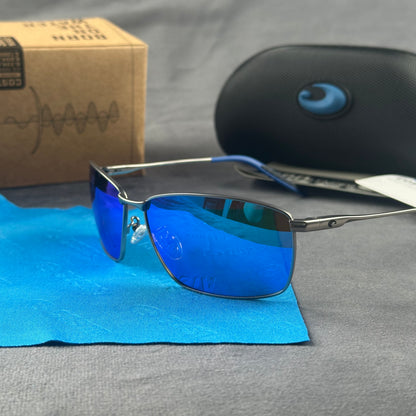 Close-up of performance polarized sunglasses with blue mirror lenses and lightweight metal frame.