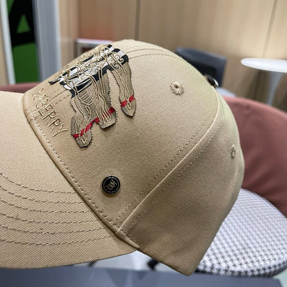 Khaki baseball cap with detailed embroidery on the front and an adjustable strap closure.