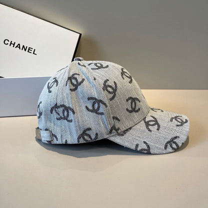 Classic monogram patterned denim baseball cap with an adjustable metallic buckle strap.