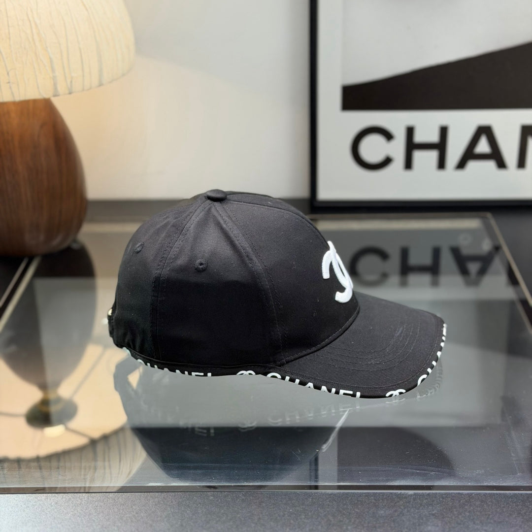 A classic black baseball cap featuring white embroidered logo, sturdy cotton blend, adjustable strap