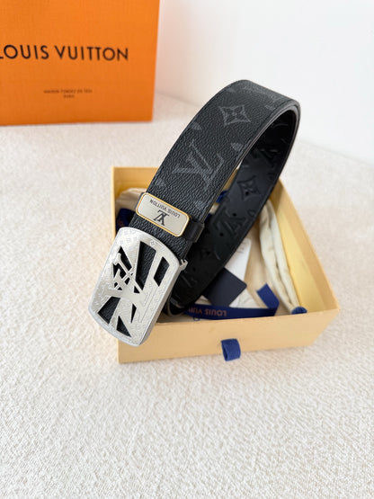 A black leather belt with monogram pattern and an intricate silver-tone buckle, 3.8cm wide.