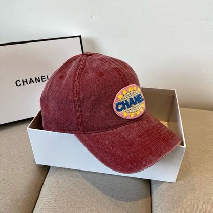 Red distressed cotton baseball cap featuring a colorful embroidered circular graphic patch.