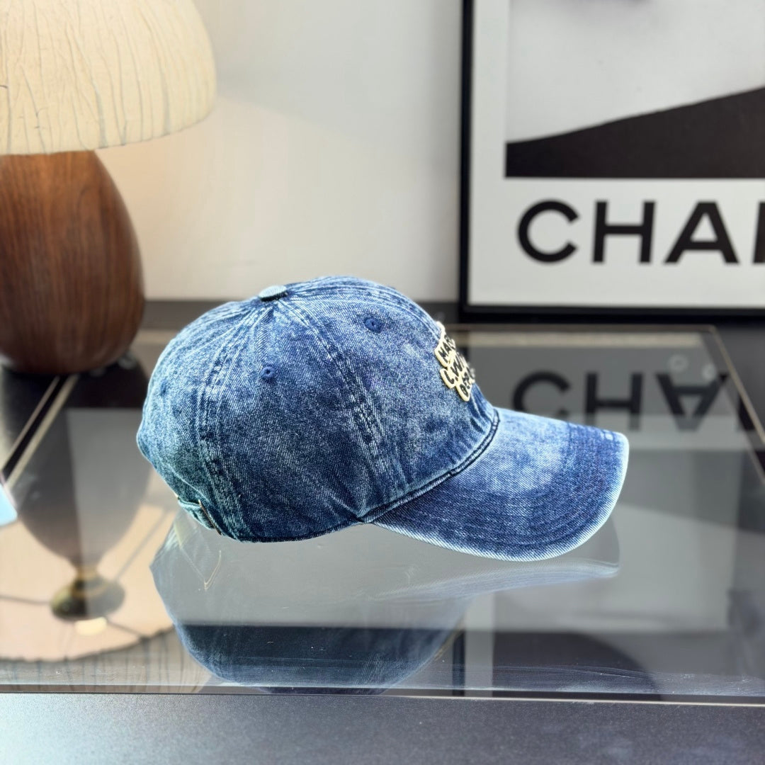 A vintage acid-washed denim baseball cap with embroidered logo detail, styled for a casual look.