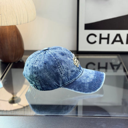 A vintage acid-washed denim baseball cap with embroidered logo detail, styled for a casual look.