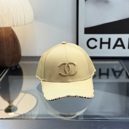 A premium structured baseball cap in a neutral beige tone featuring an embroidered central logo.