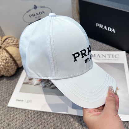 A clean white baseball cap featuring black embroidered lettering, structured crown, and curved visor