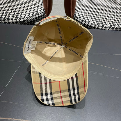Khaki baseball cap with detailed embroidery on the front and an adjustable strap closure.