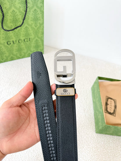 Premium black leather belt with a modern silver automatic steel buckle and detailed grain texture.
