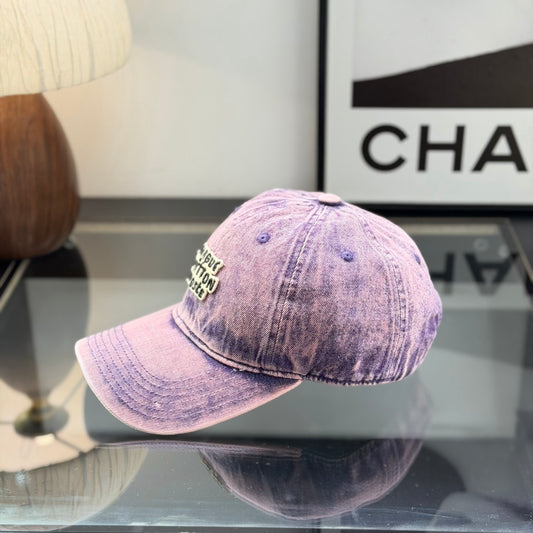 Distressed purple washed denim baseball cap with front embroidery patch, adjustable strap back.