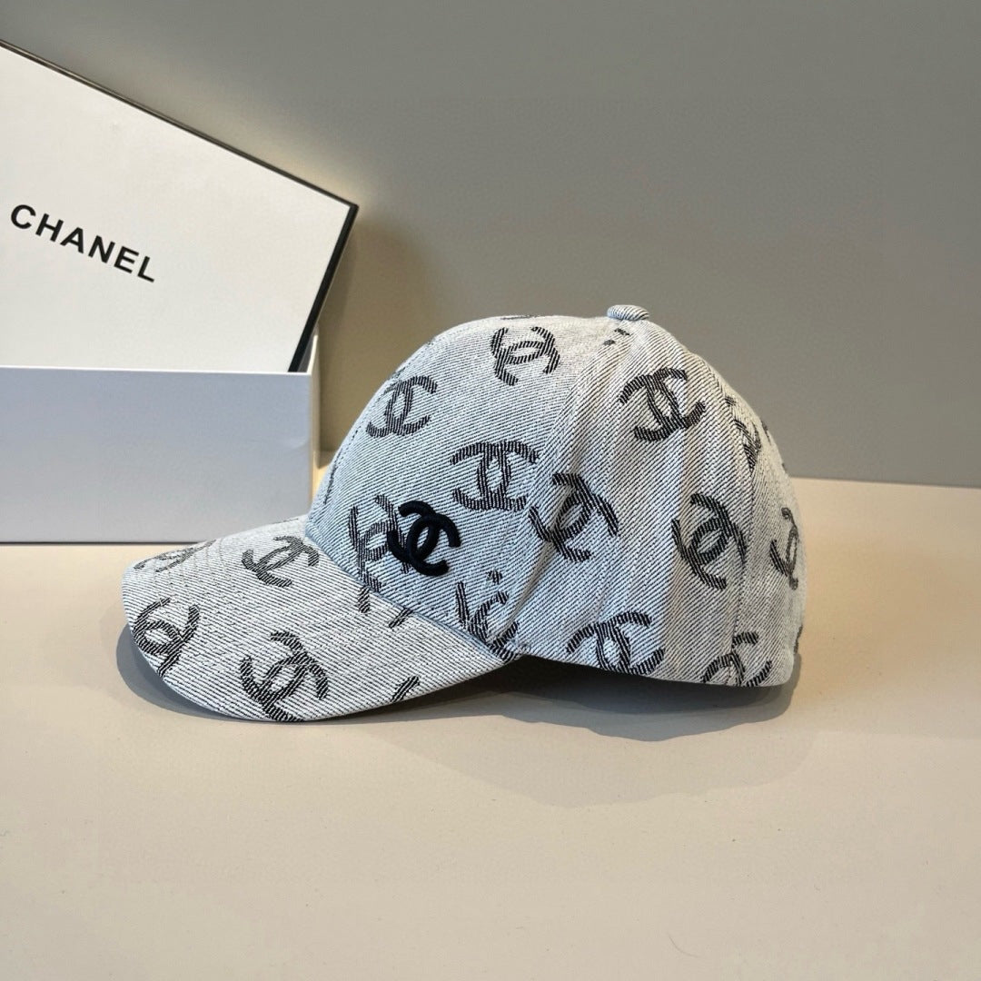 Classic monogram patterned denim baseball cap with an adjustable metallic buckle strap.