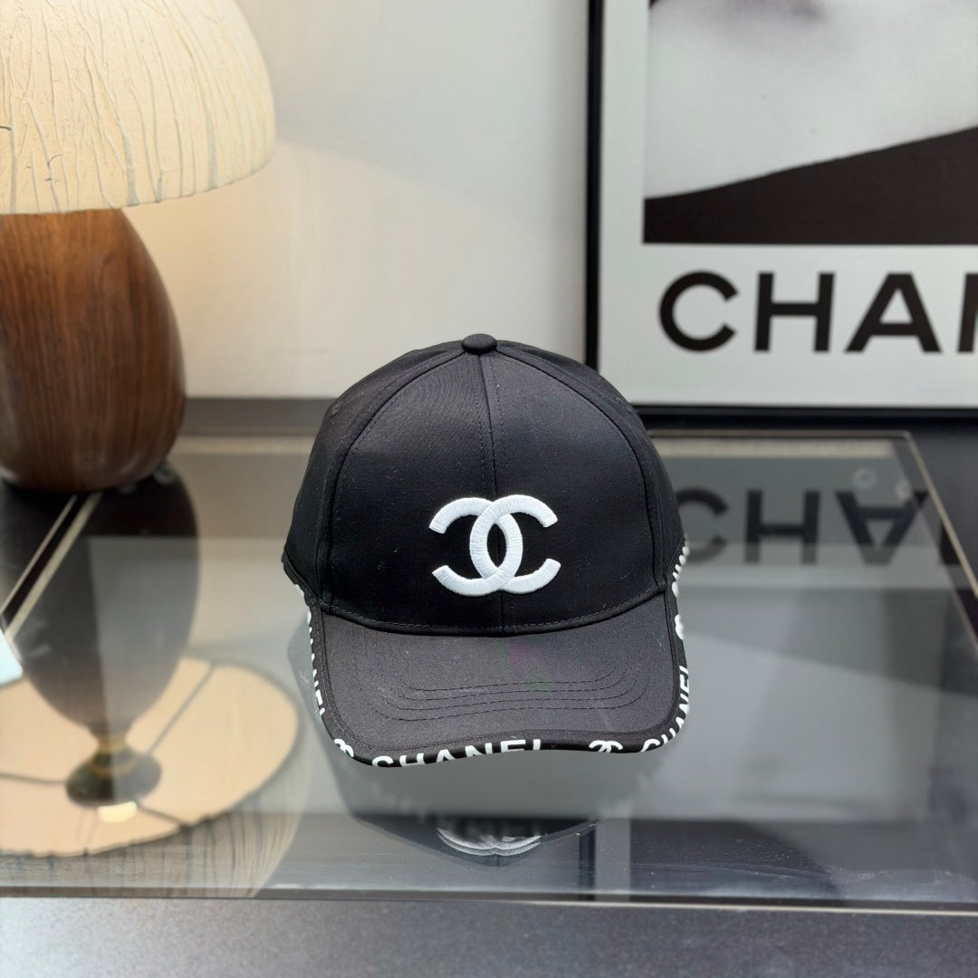 A classic black baseball cap featuring white embroidered logo, sturdy cotton blend, adjustable strap