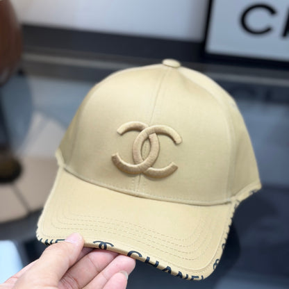 A premium structured baseball cap in a neutral beige tone featuring an embroidered central logo.