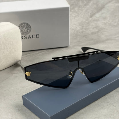 Modern shield sunglasses with a sleek black frame and dark tinted lenses on a grey background.