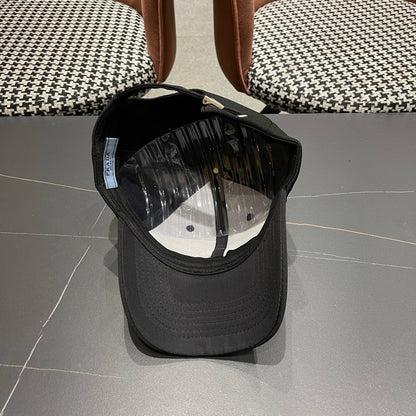 A black premium structured baseball cap with a centered metal triangular emblem on the front.