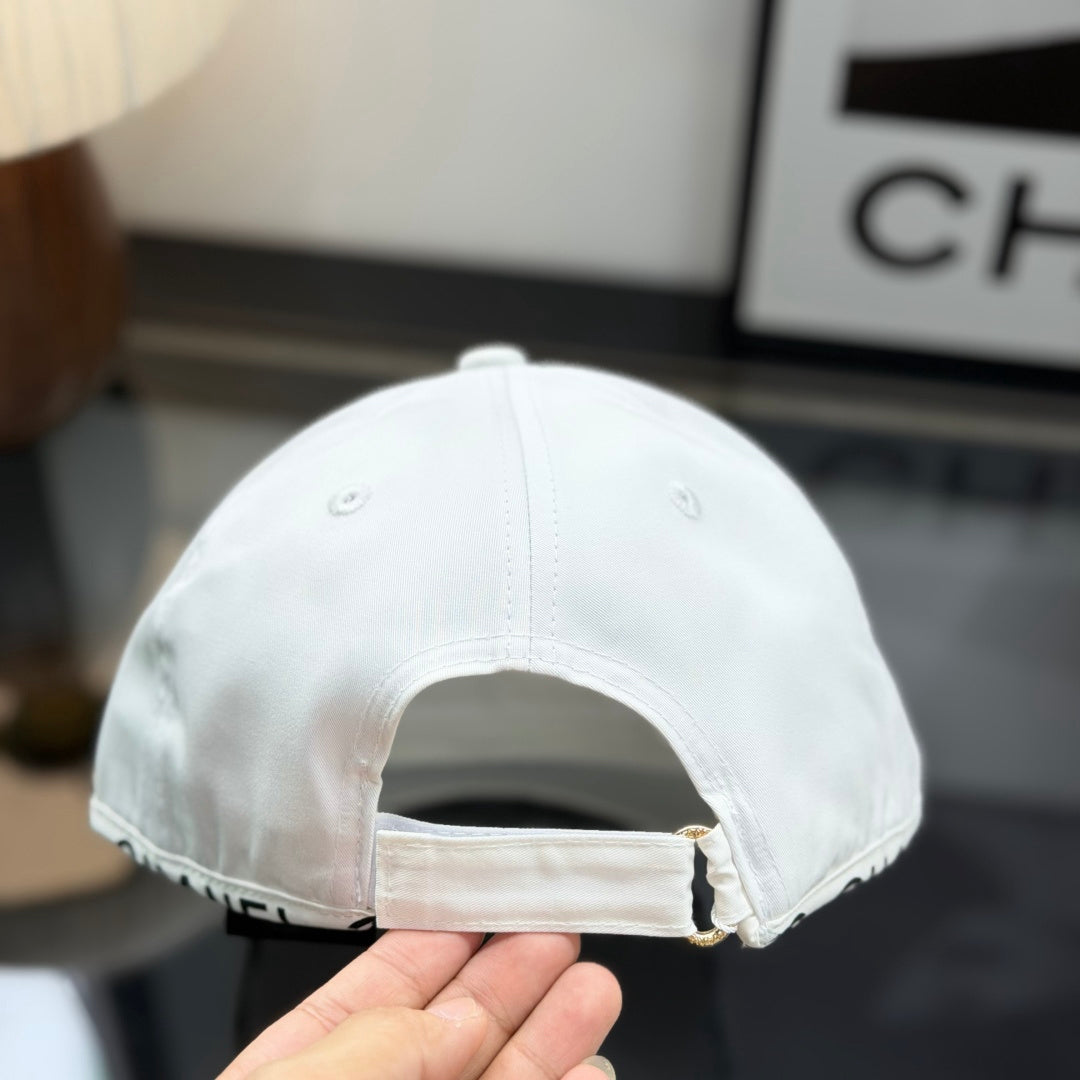 A white premium baseball cap with black embroidered logo details on a clean display surface.
