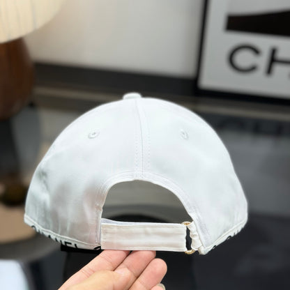 A white premium baseball cap with black embroidered logo details on a clean display surface.
