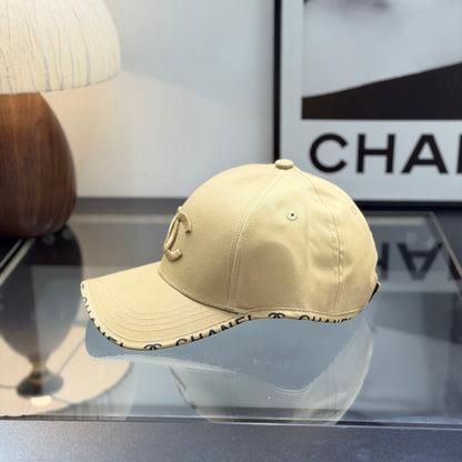 A premium structured baseball cap in a neutral beige tone featuring an embroidered central logo.