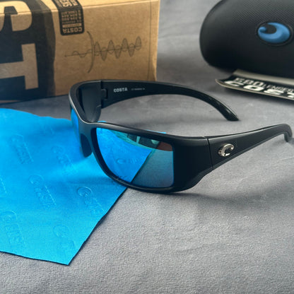 Matte black frame sport sunglasses with blue mirror lenses, including a protective case and cloth.