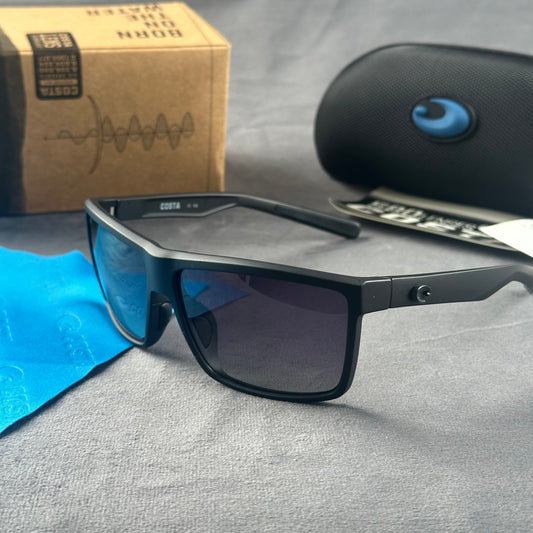 Matte black sport sunglasses with polarized blue-tinted lenses, hard case, and cleaning cloth.